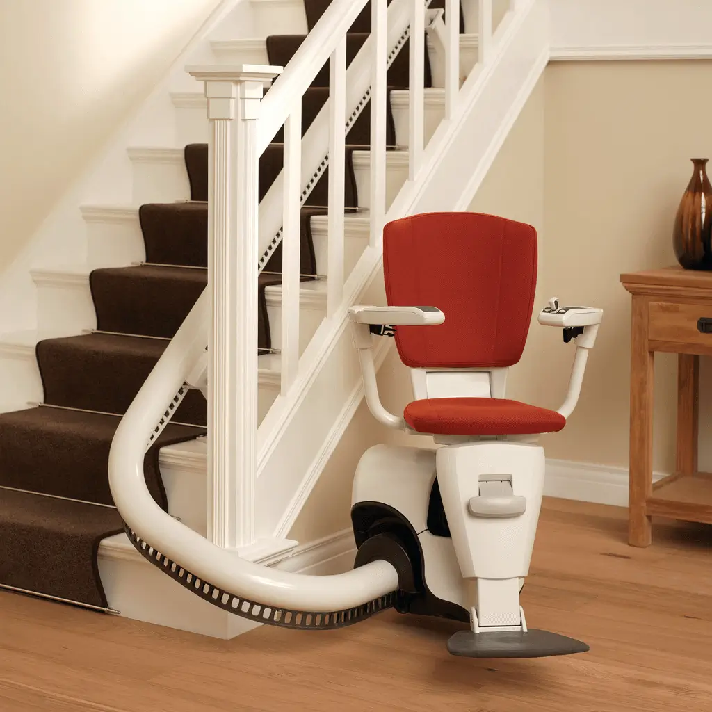 Electric swivel stairlift seat on narrow staircase in Shidler