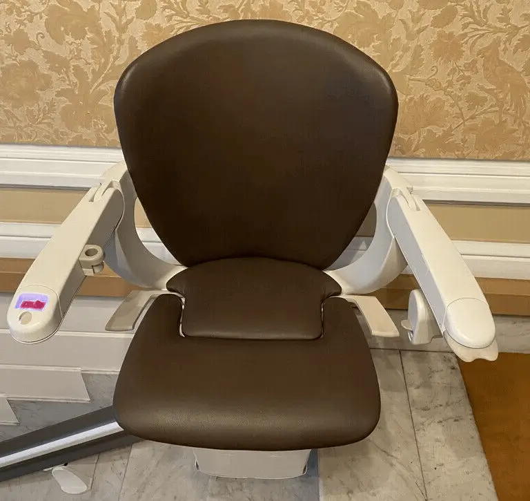 Brown leather stairlift seat close-up in Shidler